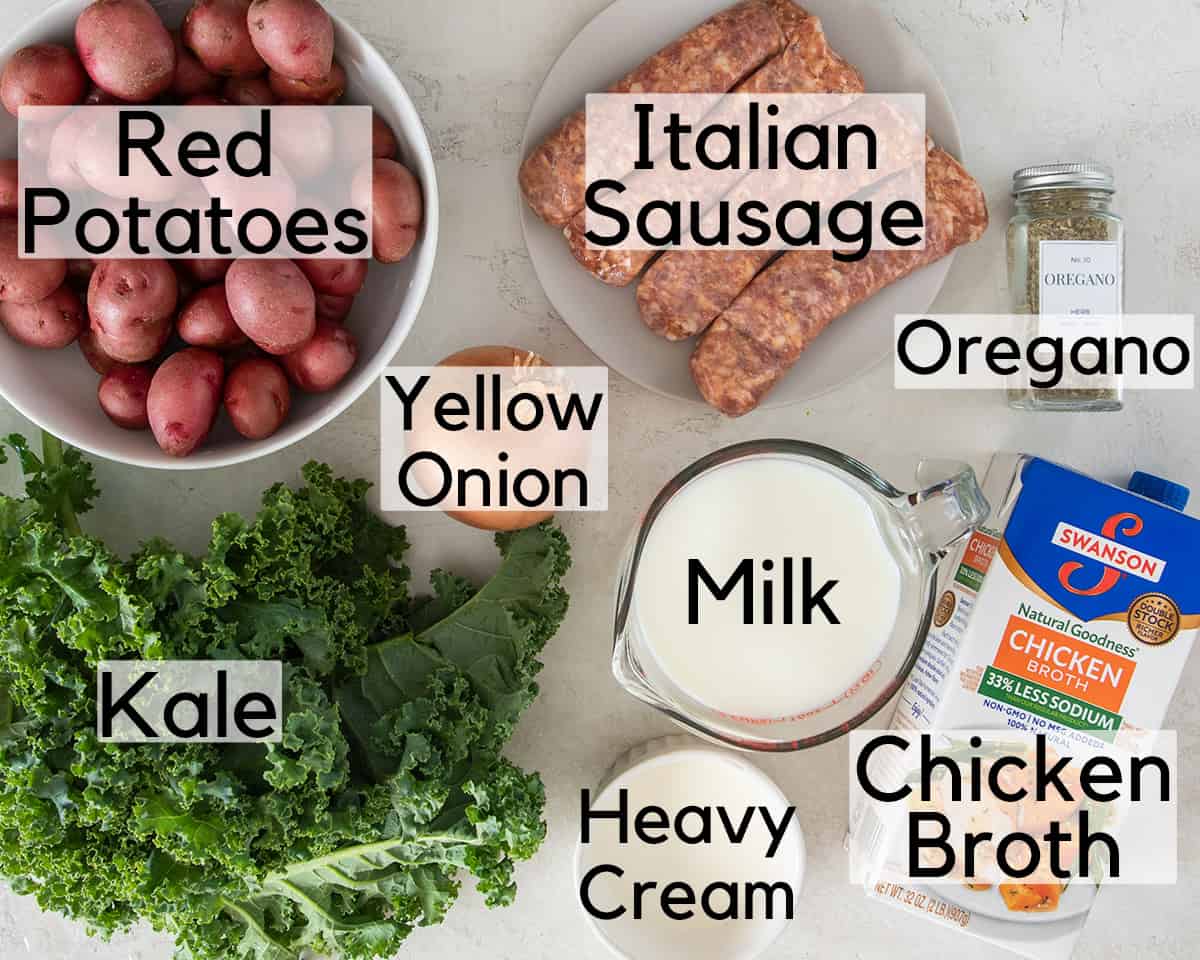 Ingredients for Sausage Kale Soup laid out on table with text labels.