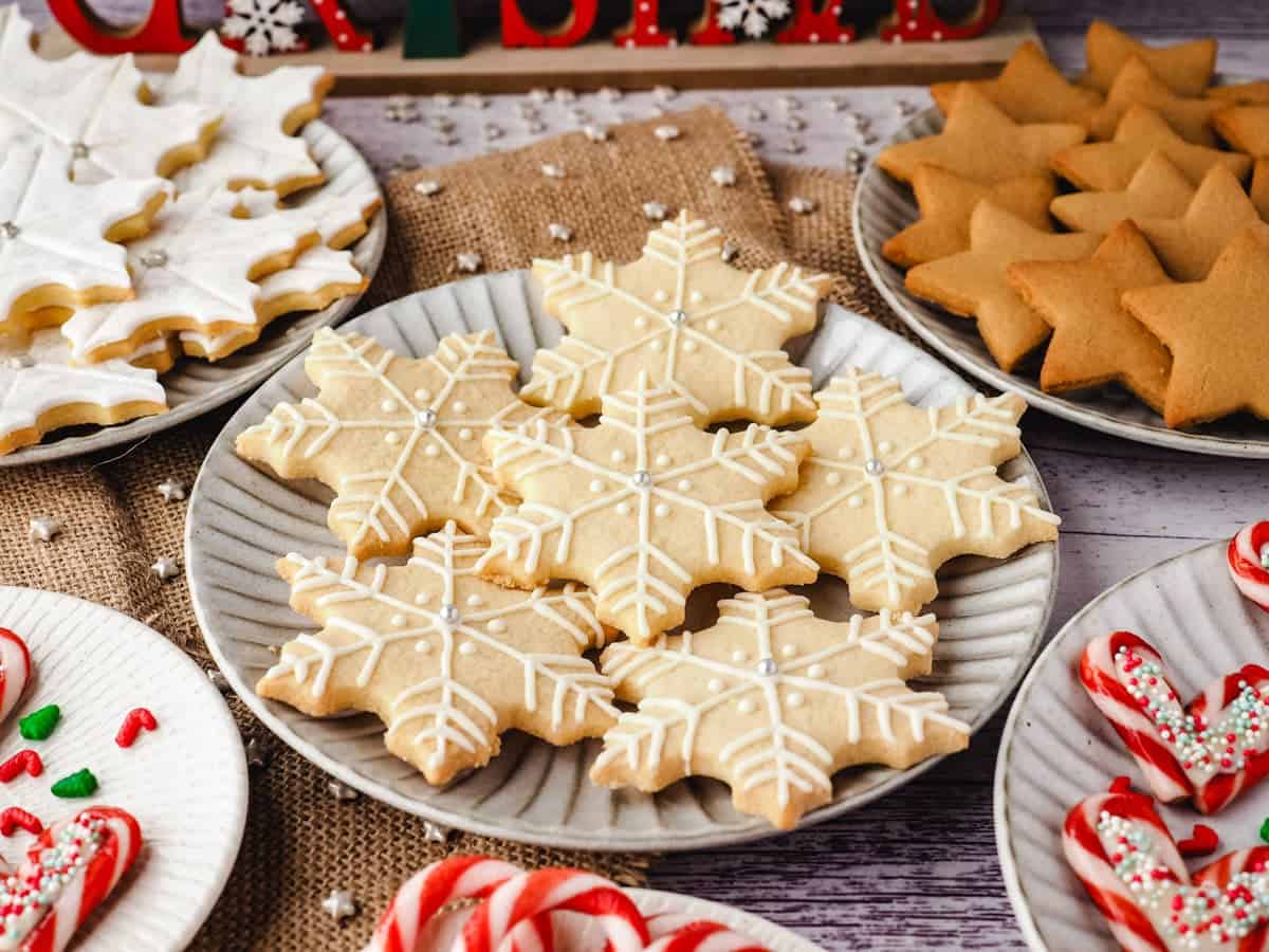 A plate of snowflake cookies for decorated with royal icing.