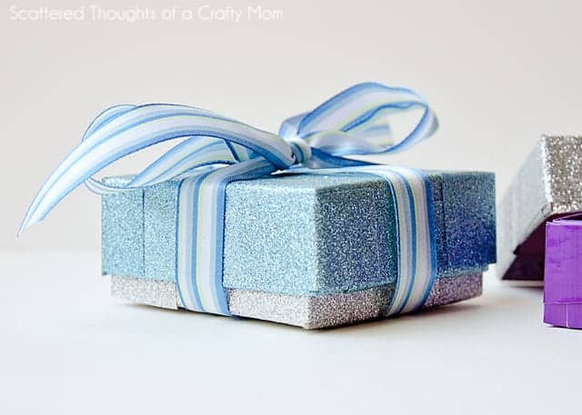 Gift wrapped in silver and blue gift box made with duct tape and cereal box.