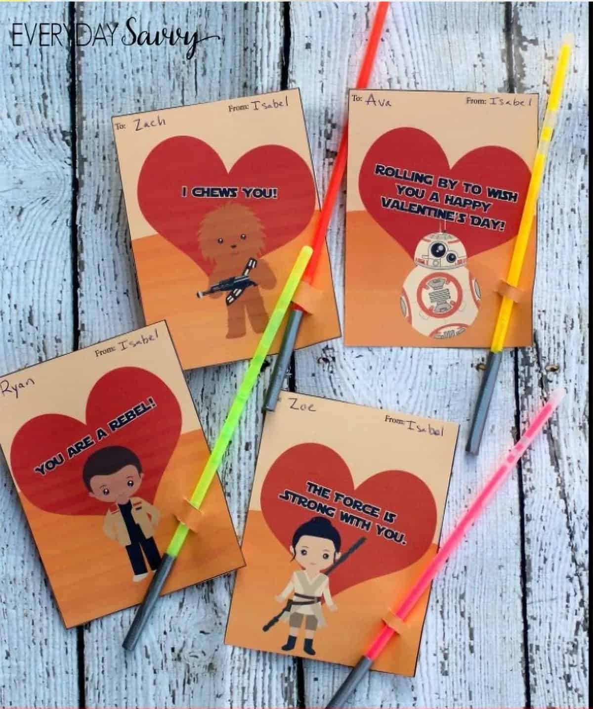 Star wars themed cards with lightsaber glow sticks attached to them.