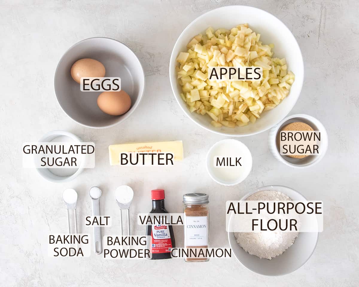 Ingredients for Apple cake laid out on a table with text labels.