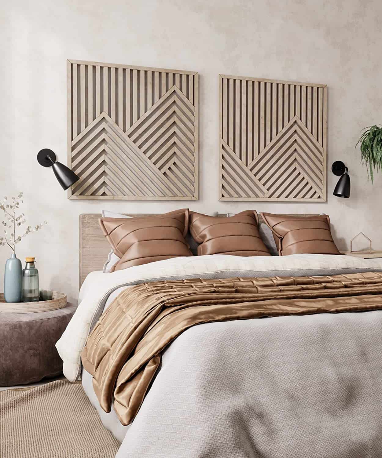 Two large wooden mountain style geometric wall panels in a natural finish centered on a neutral bedroom wall.