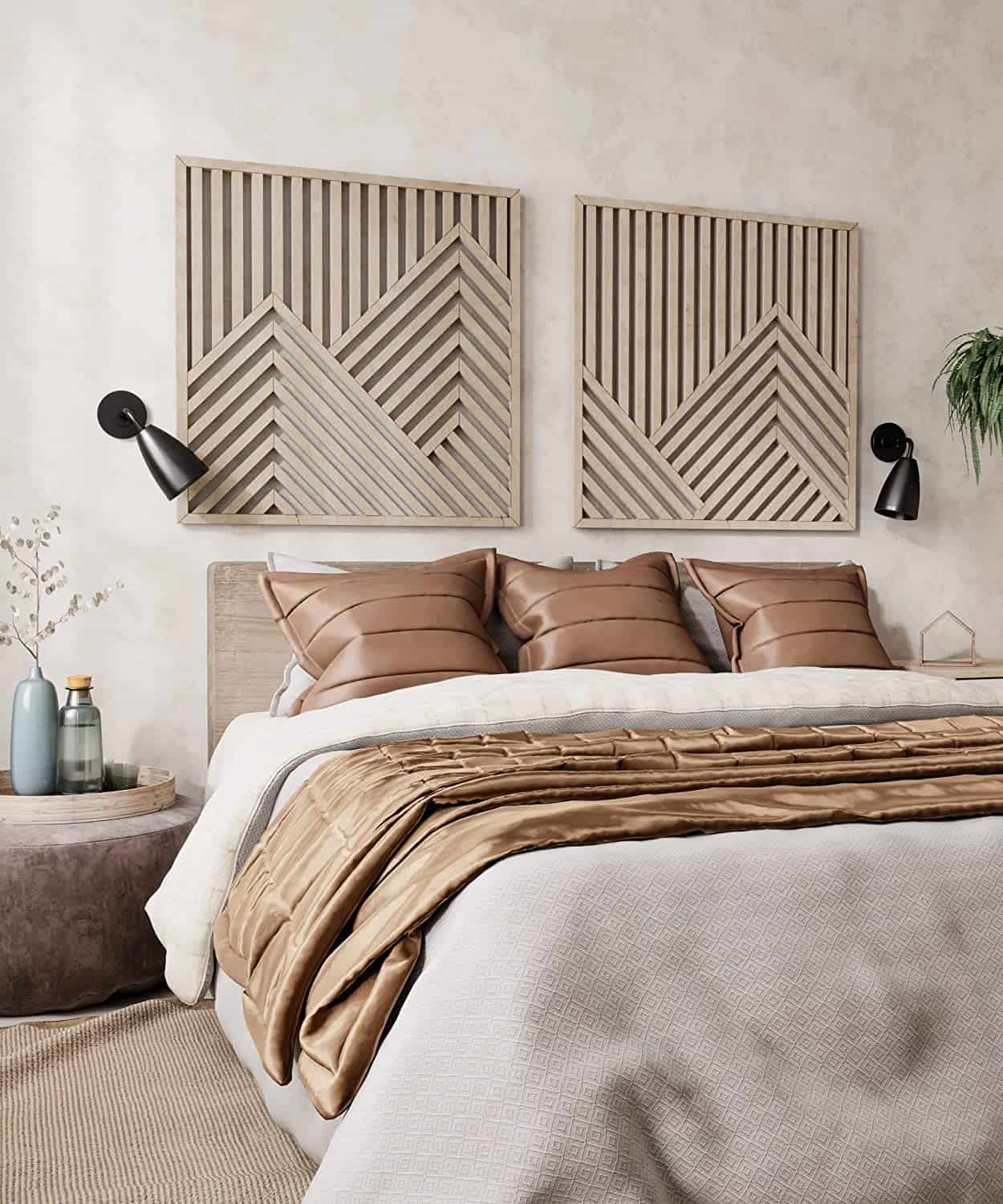 Two large wooden mountain style geometric wood wall panels in a natural finish centered on a neutral bedroom wall.