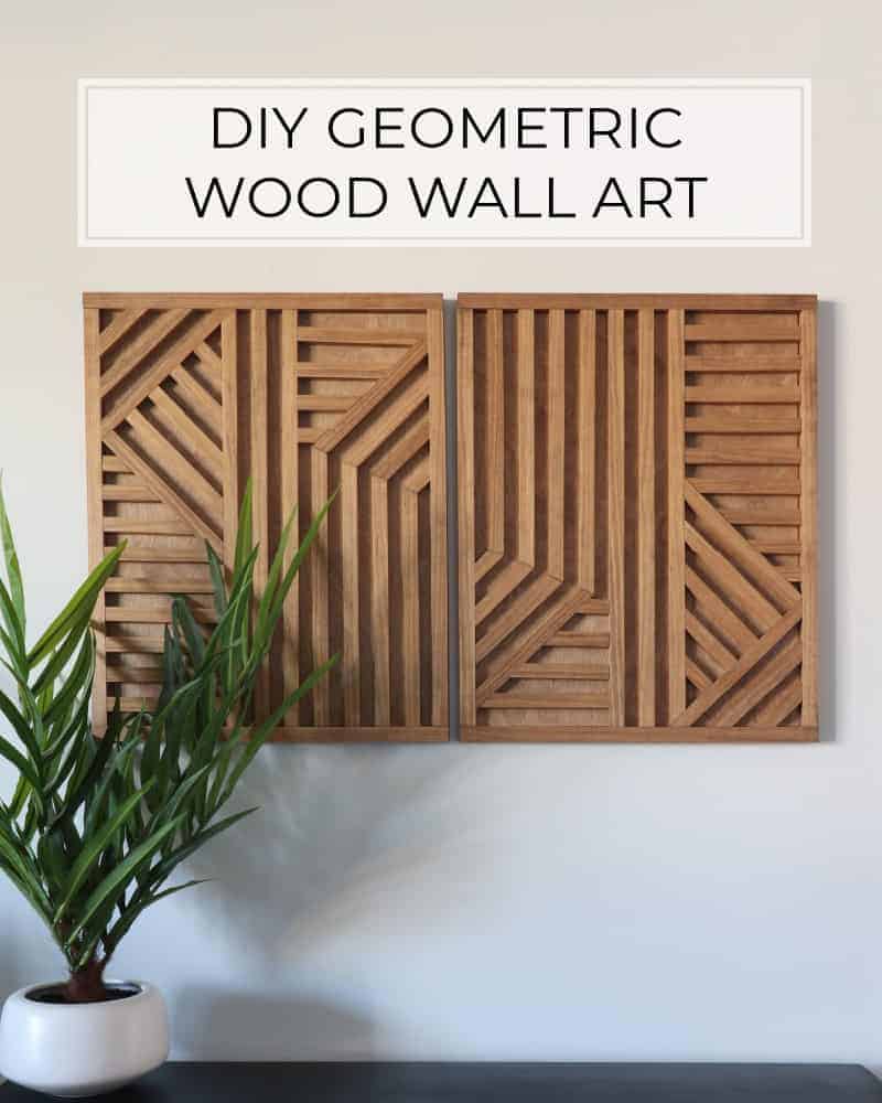 Two large geometric wood wall decor pieces. Grey walls and potted plant in foreground.