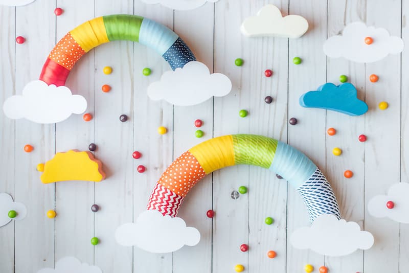 Two rainbow wreaths that use leftover ribbon wrapped around a Styrofoam core.