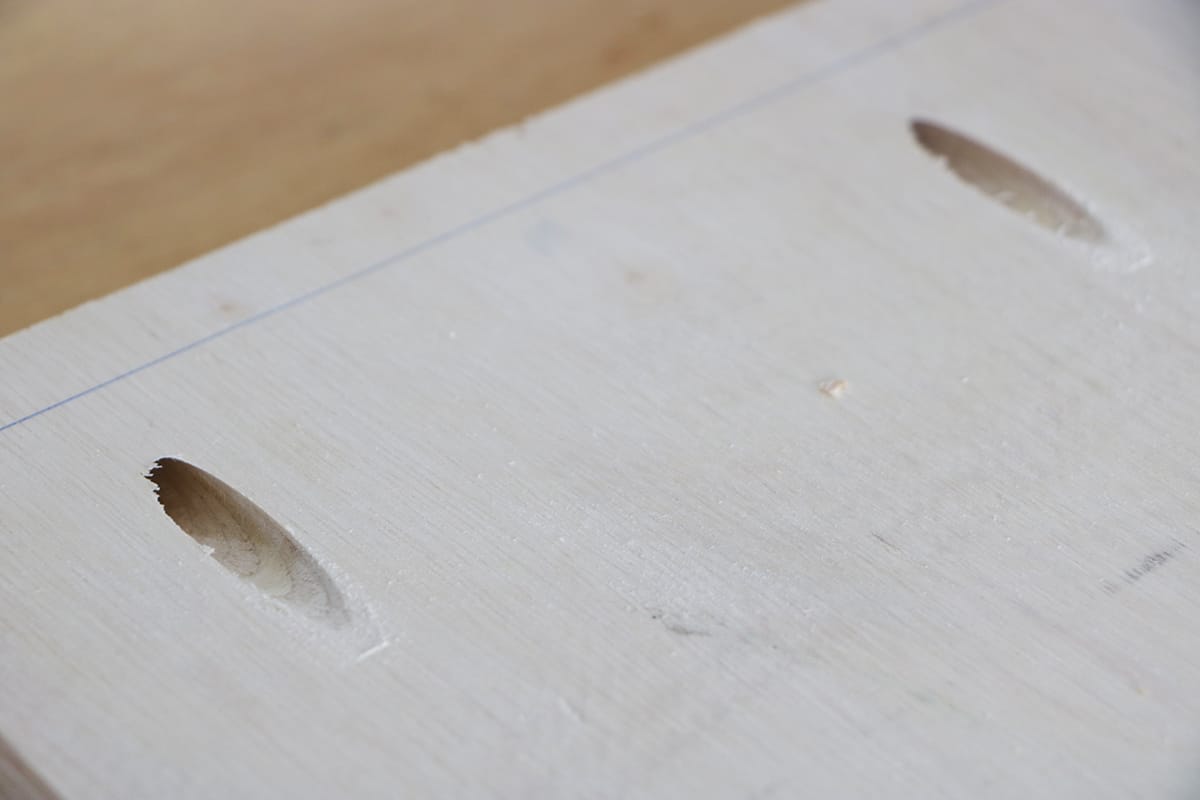 Pocket holes shown in wood to put woodworking frame together.