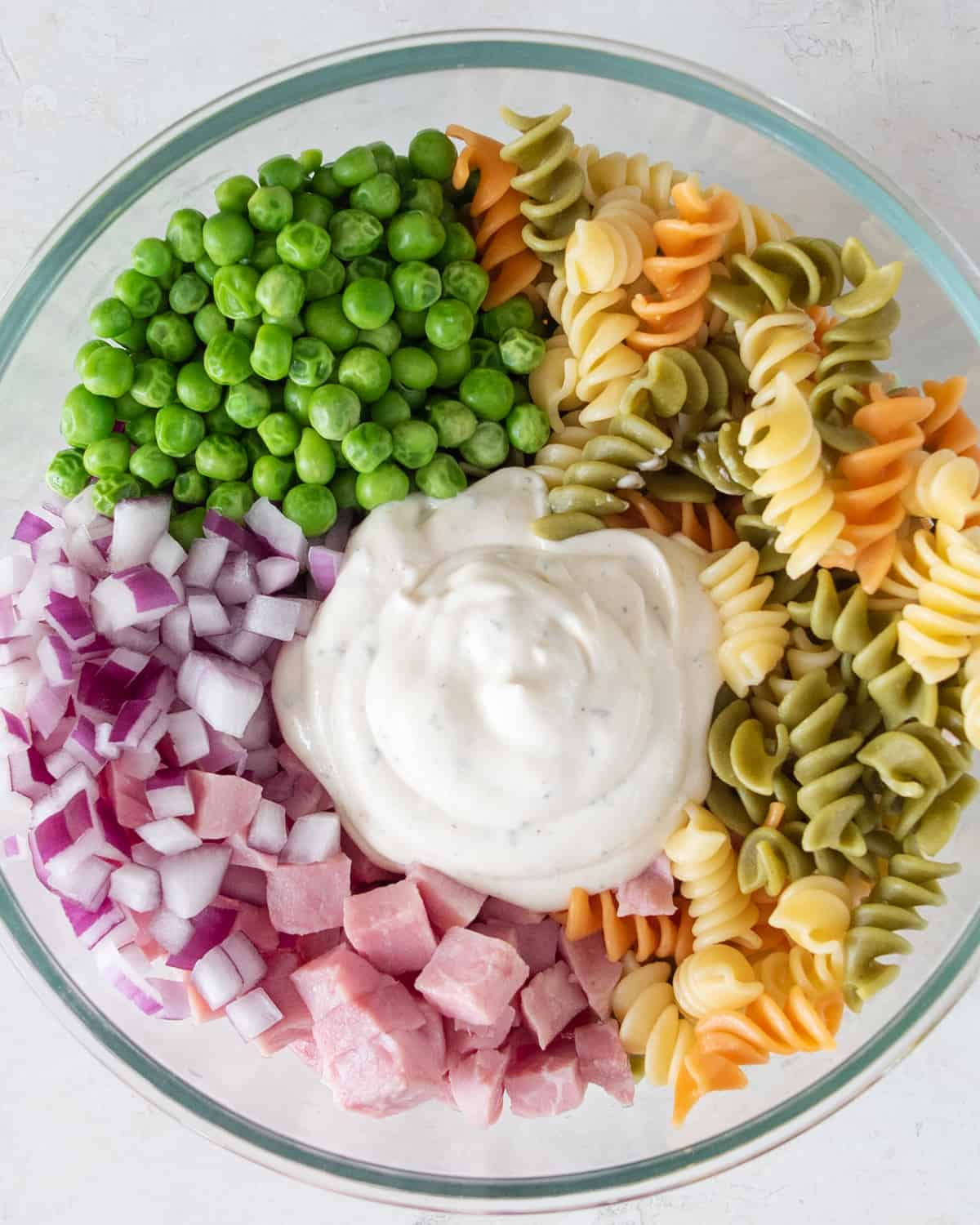 Bowl of pasta ingredients ready to be mixed.