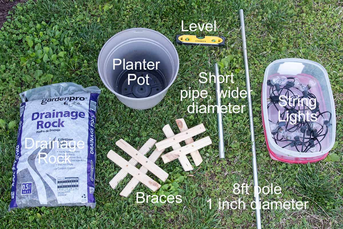 Supplies to build a string lights for a backyard with no trees using a planter pot.
