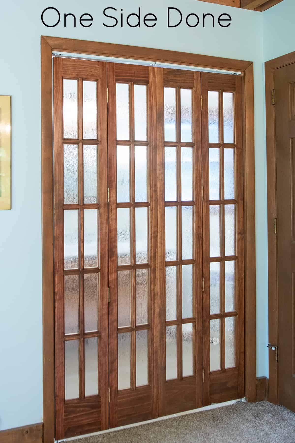 Double wood glass doors with window film for privacy.