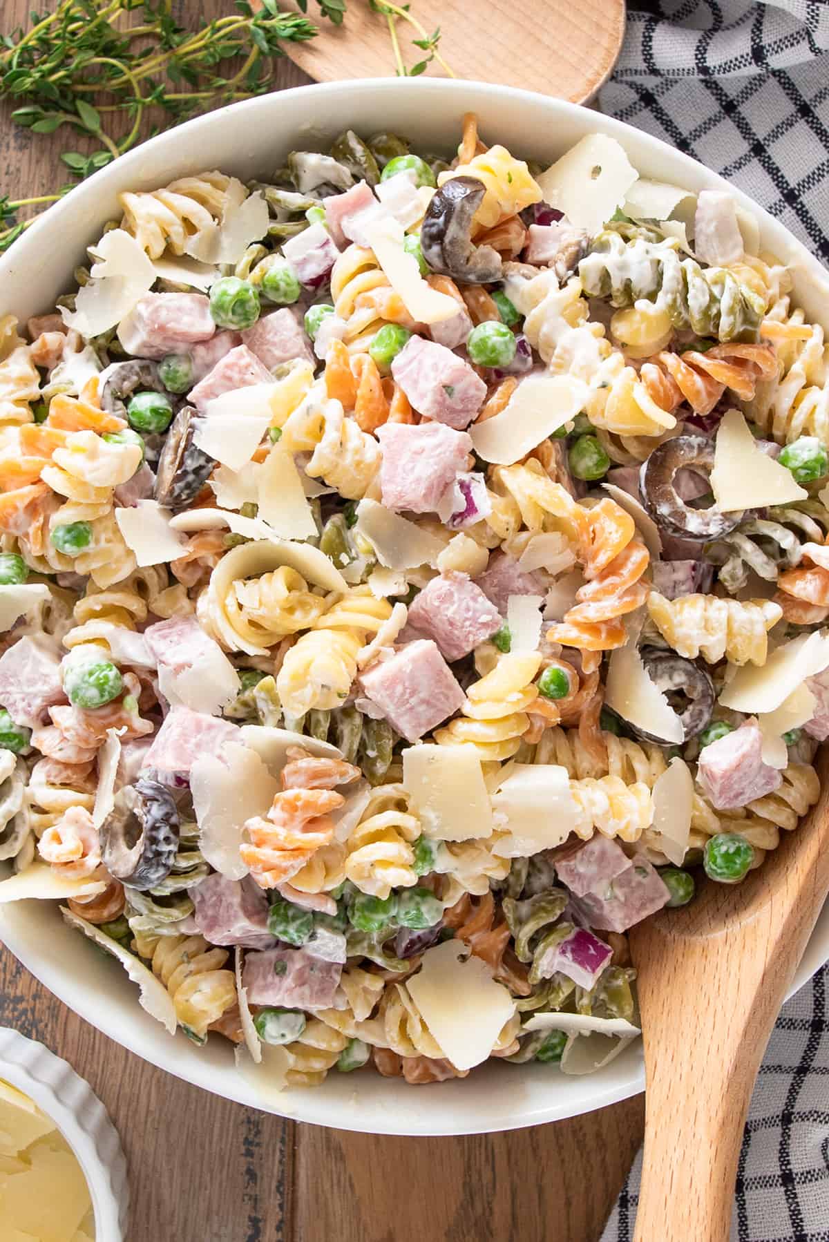 Tricolor Pasta Salad with creamy dressing in a bowl with a spoon.