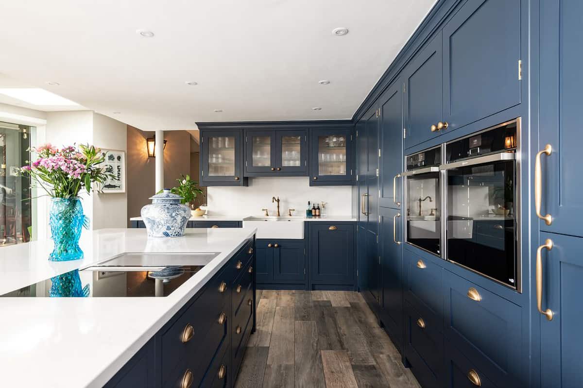 Benjamin Moore Van Deusen Blue kitchen cabinets and island in this handsome kitchen galley design 