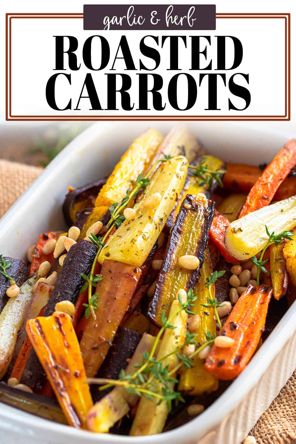 Easy roasted carrots topped with pine nuts and thyme with title overlay.