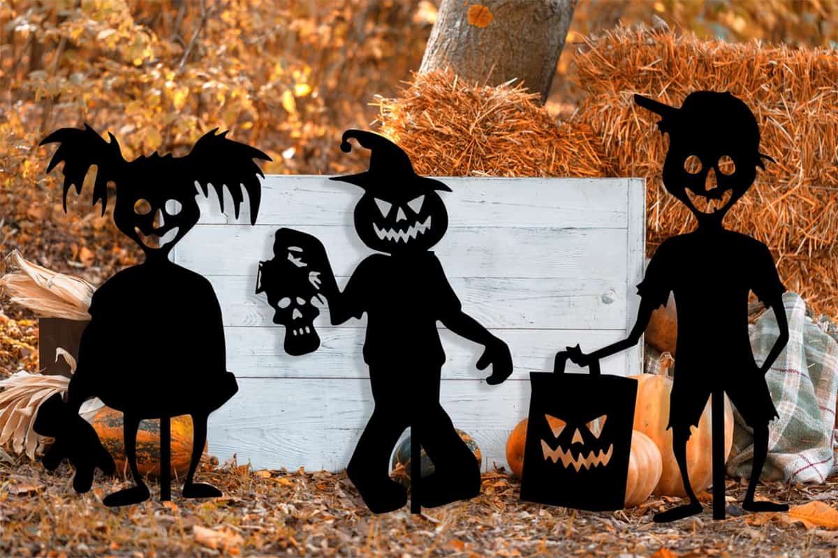 Zombie kids and scarecrow metal silhouette yard stakes.