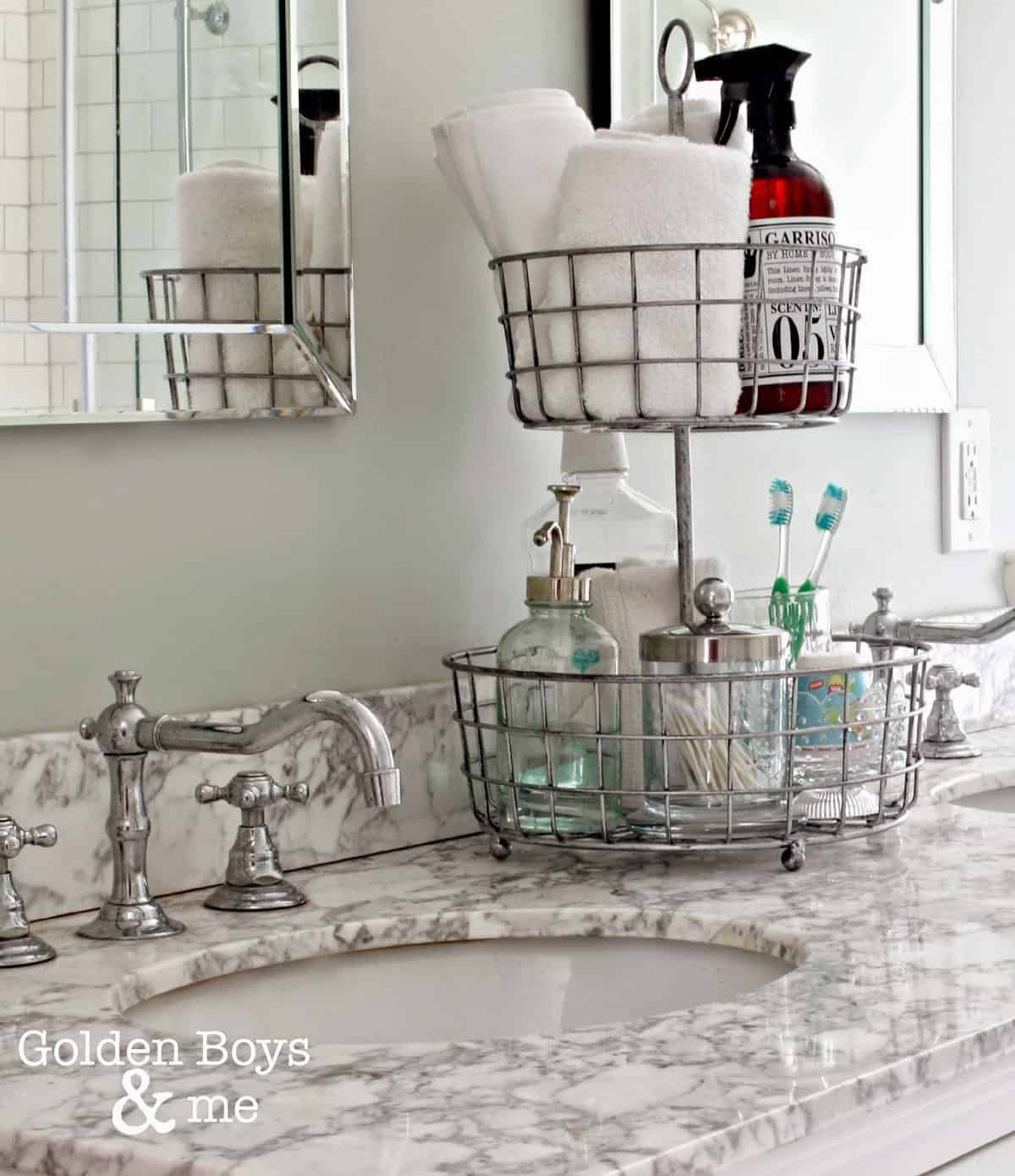 2-tiered chrome basket tray with assorted bathroom toiletries