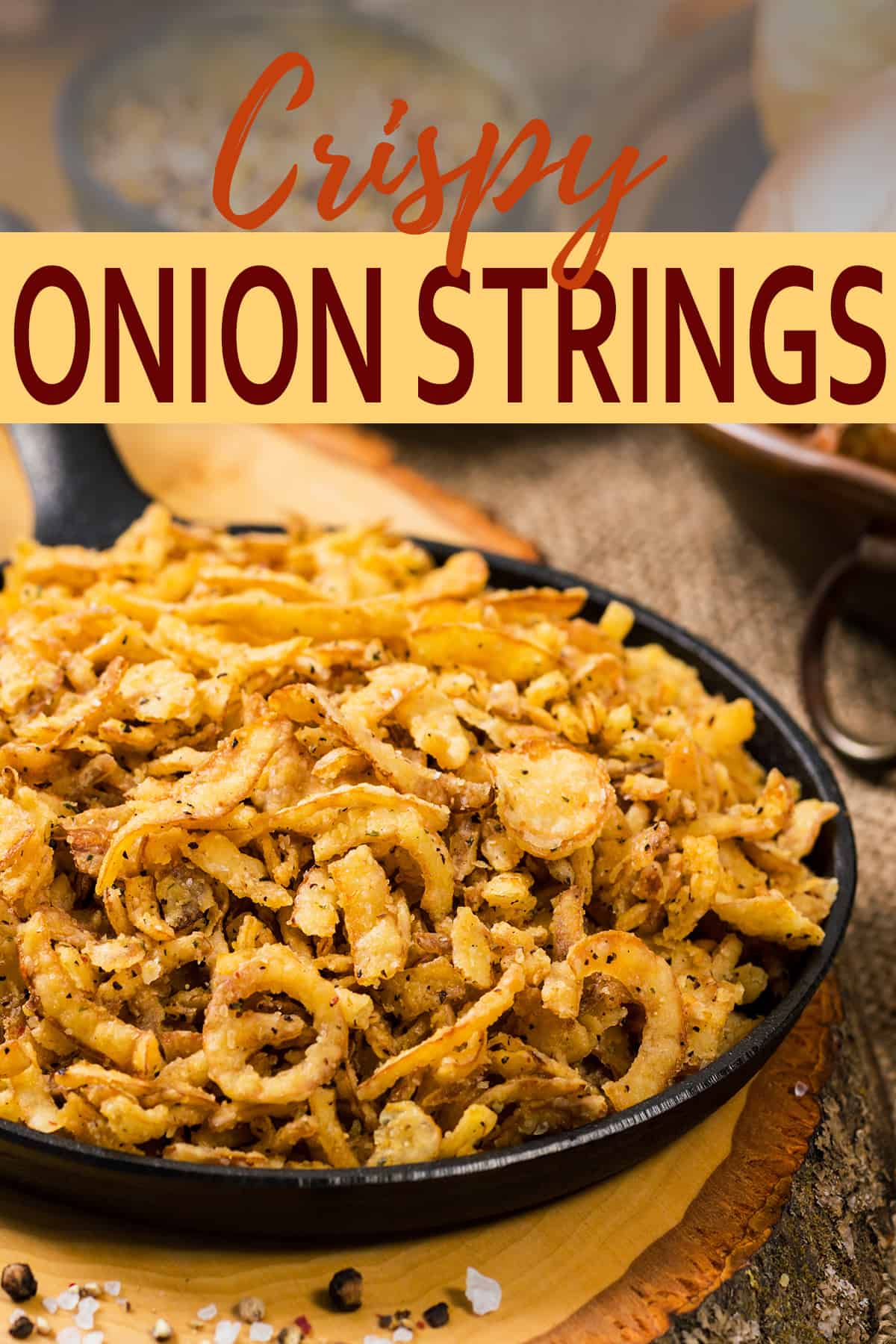 Pan full of french fried onions on a wood background.