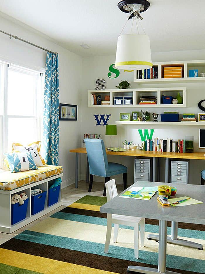Colorful kids room with desk area for homework and built in shelves.