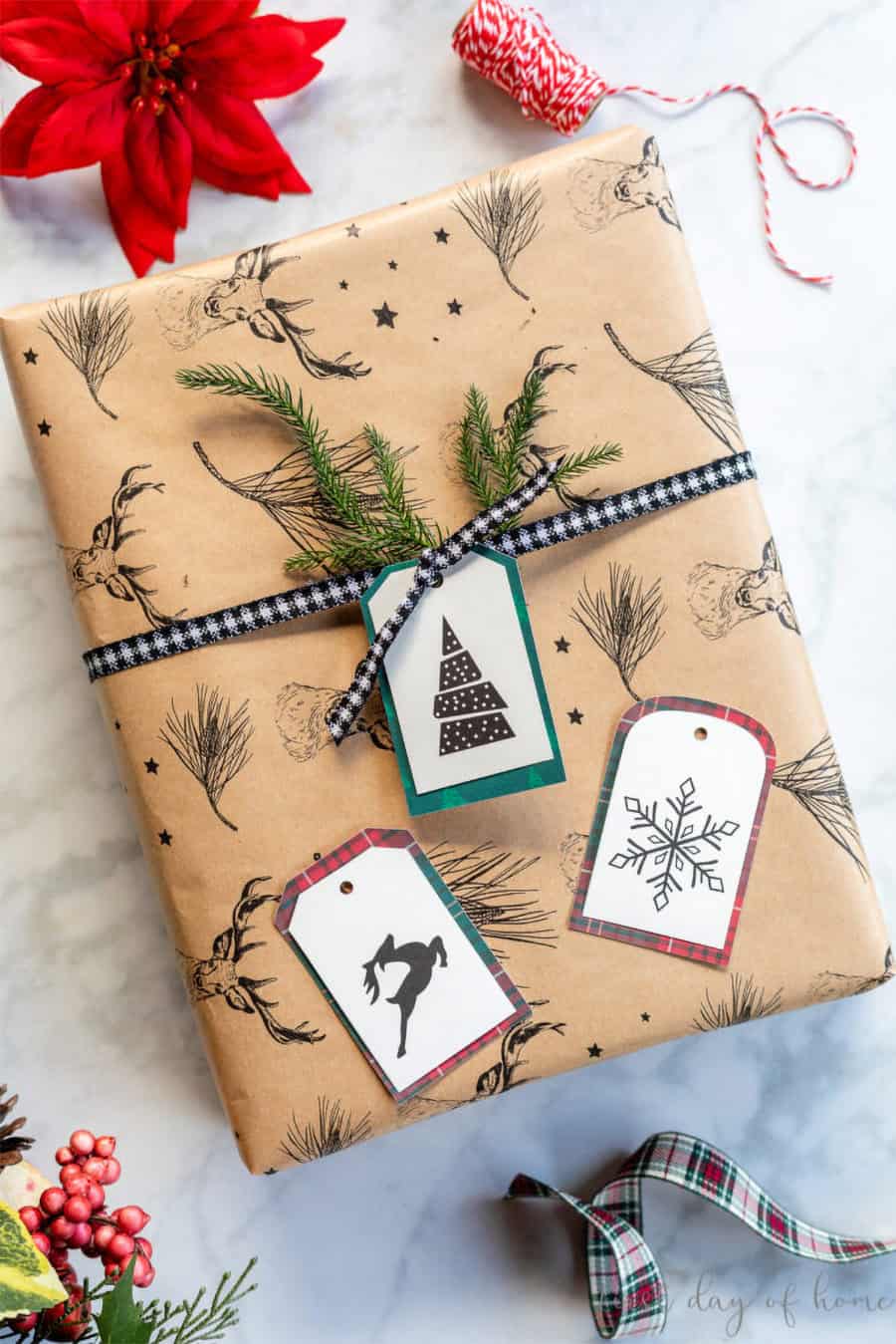 Rustic stamped gift tags on a decorated package.