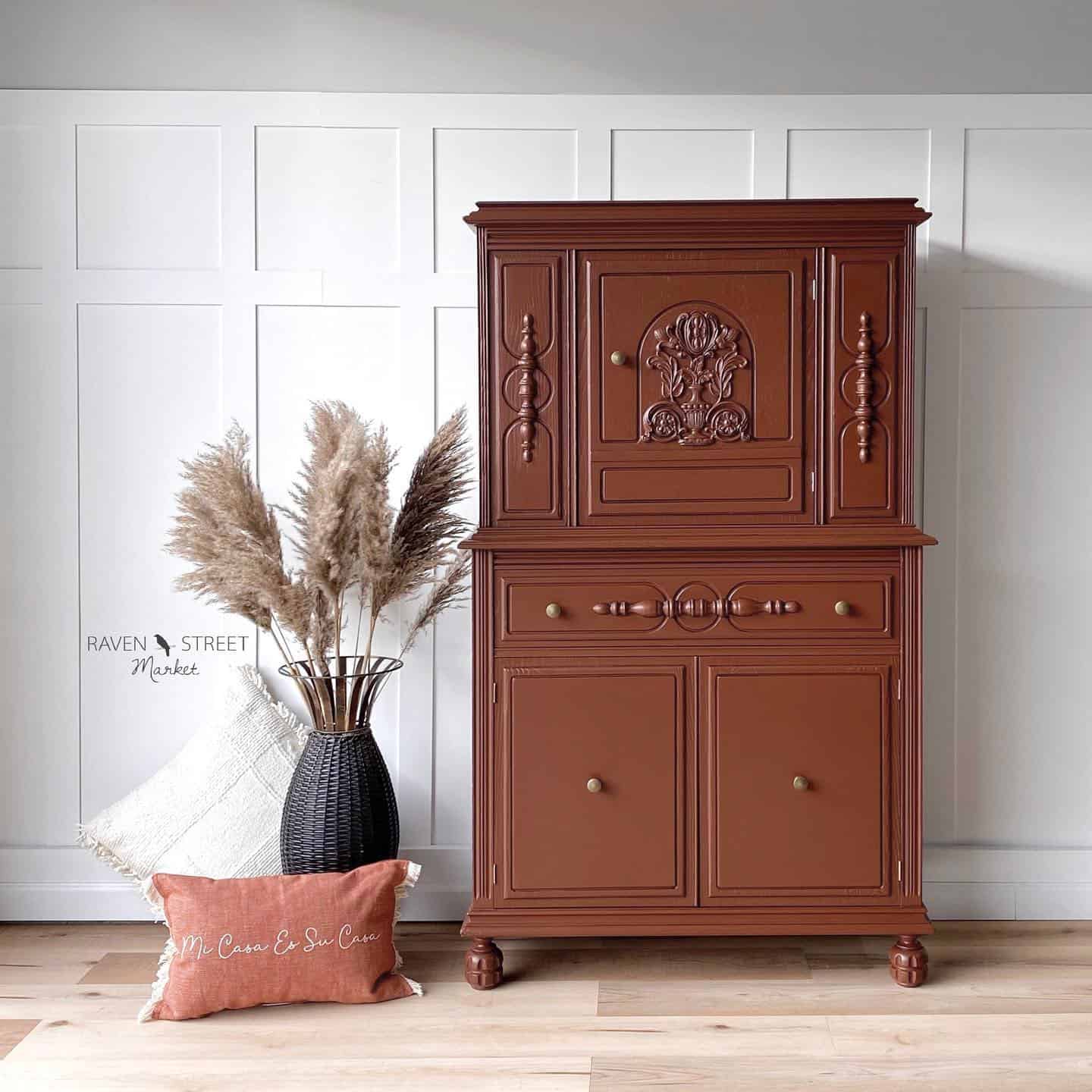 Sunset brown painted tallboy hutch with lots of details.