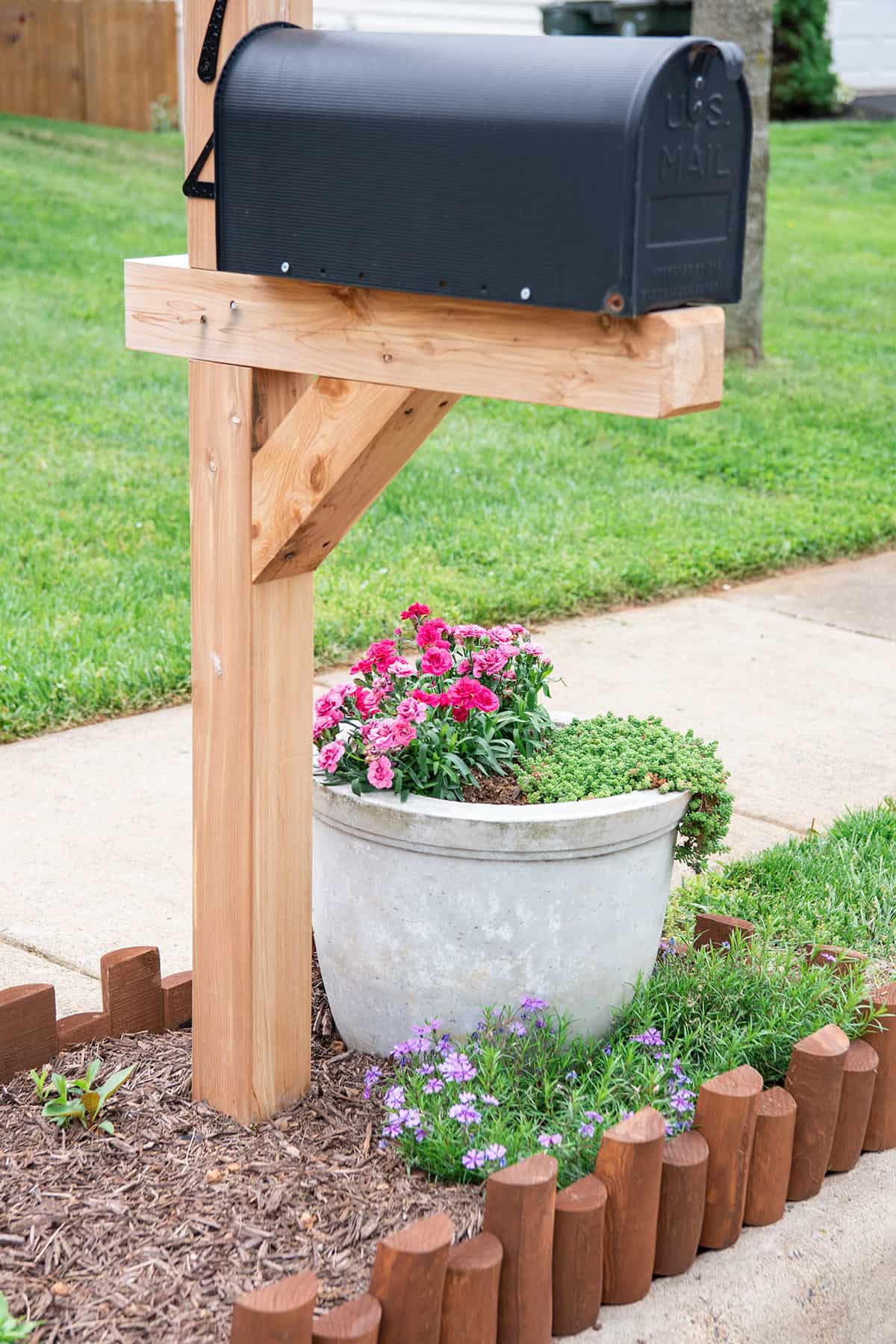 Self-watering planter in a mailbox garden idea for decoration.