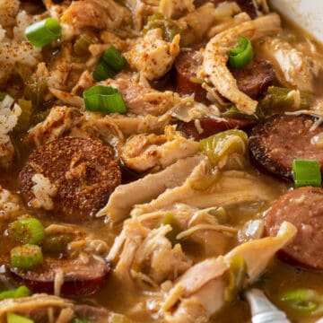 Closeup of chicken and andouille sausage gumbo in a bowl with rice.