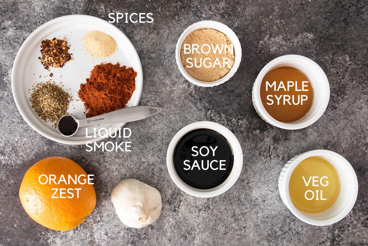 Ingredients for maple smoke marinade laid out on a table.