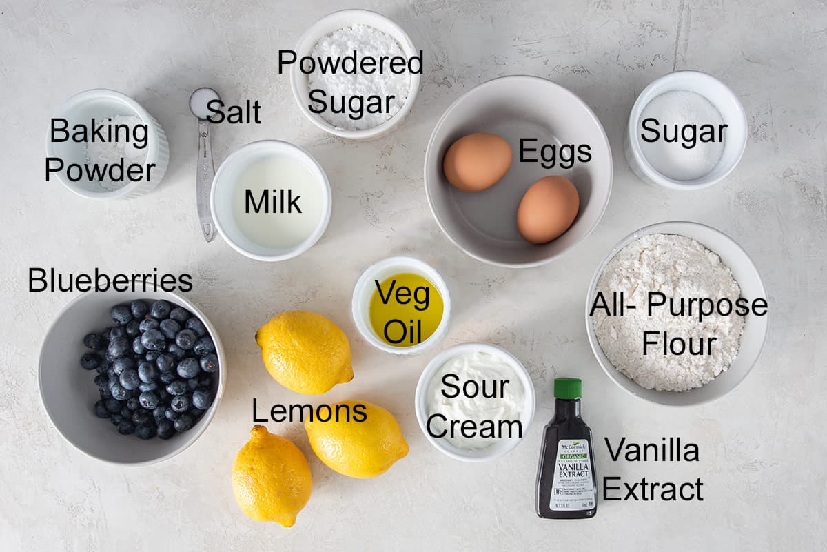 Ingredients for lemon blueberry cake laid out on a table.