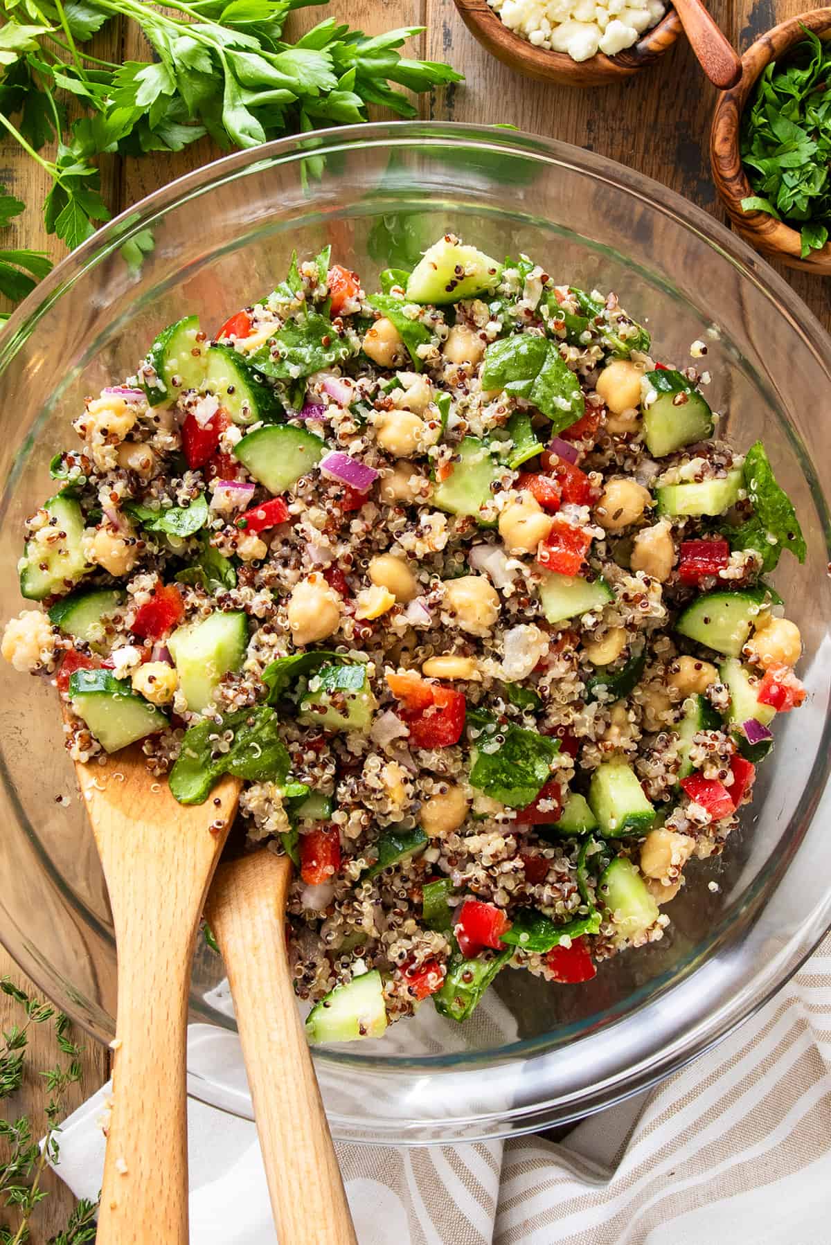 Overhead of quinoa and chickpea salad with vinaigrette dressing and Mediterranean vegetables tossed in.