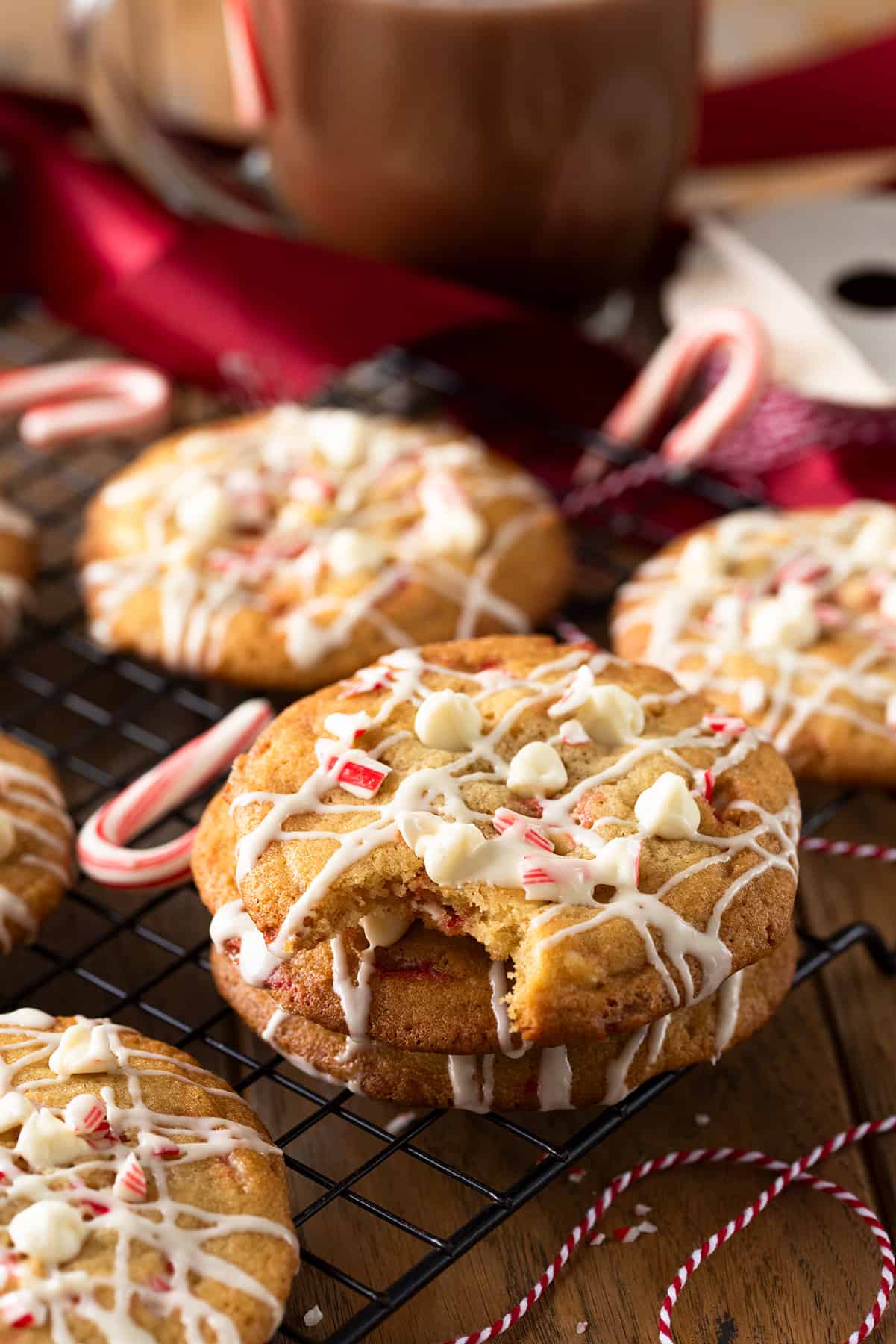 Peppermint white chocolate chip cookie with a bite taken out.