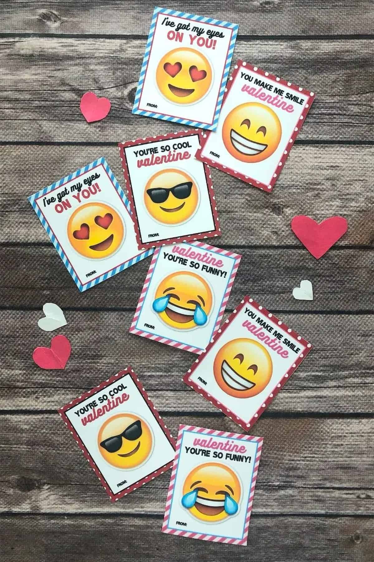 Several emojis Valentine's Day cards scattered about with you are so cool written on them.