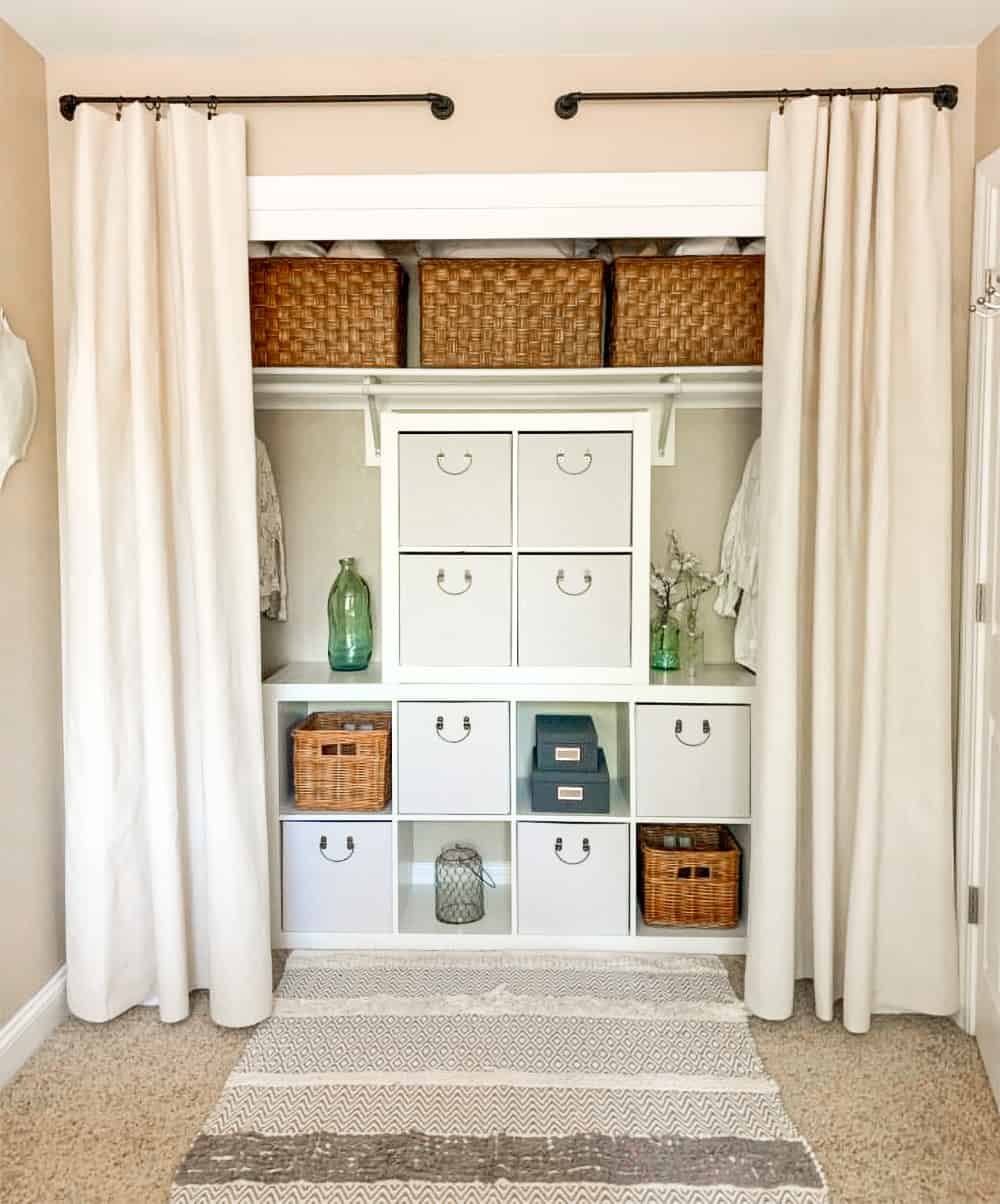 White symmetrical closet with cubbies and drawers to replace most of the hanging clothes sections.