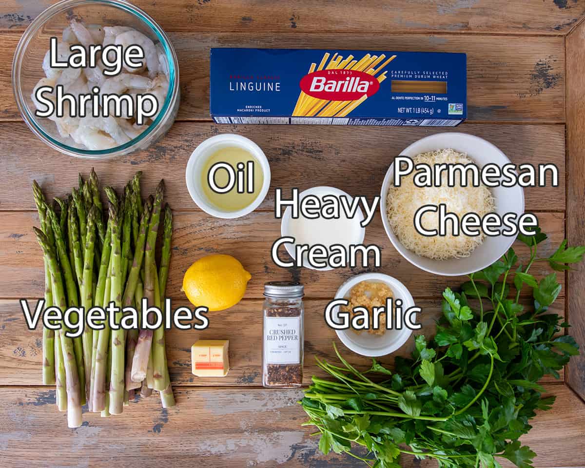 Ingredients to make lemon garlic shrimp pasta with asparagus.