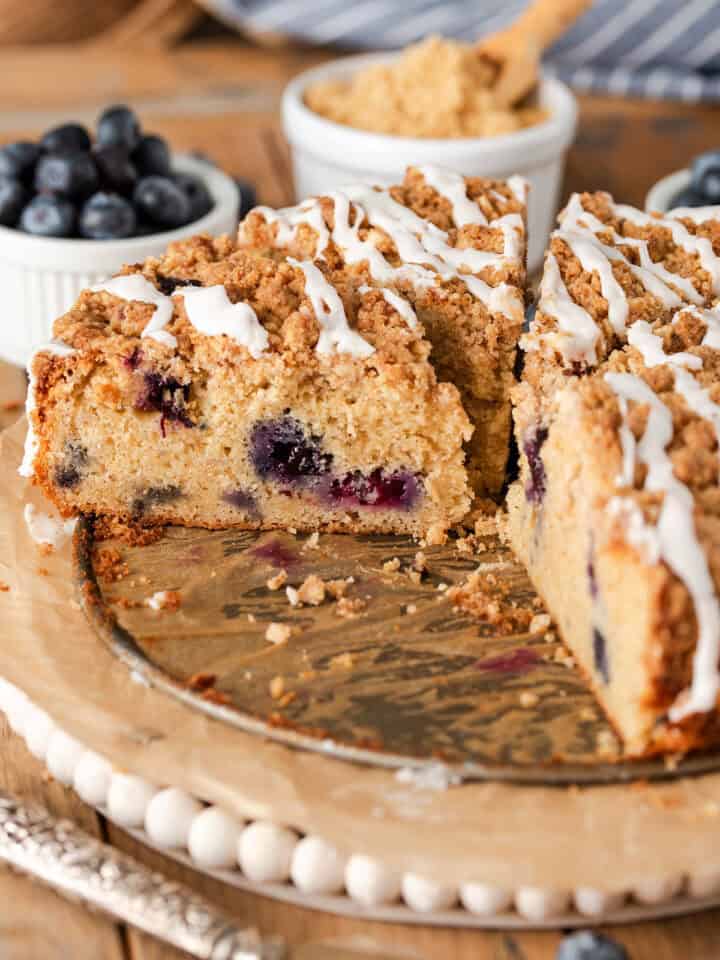 A coffee cake sliced up with one side revealing the inside texture.