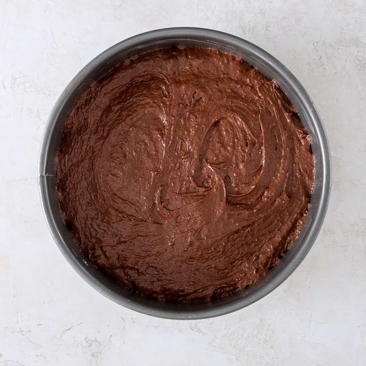 Flourless chocolate almond cake batter in a springform pan.