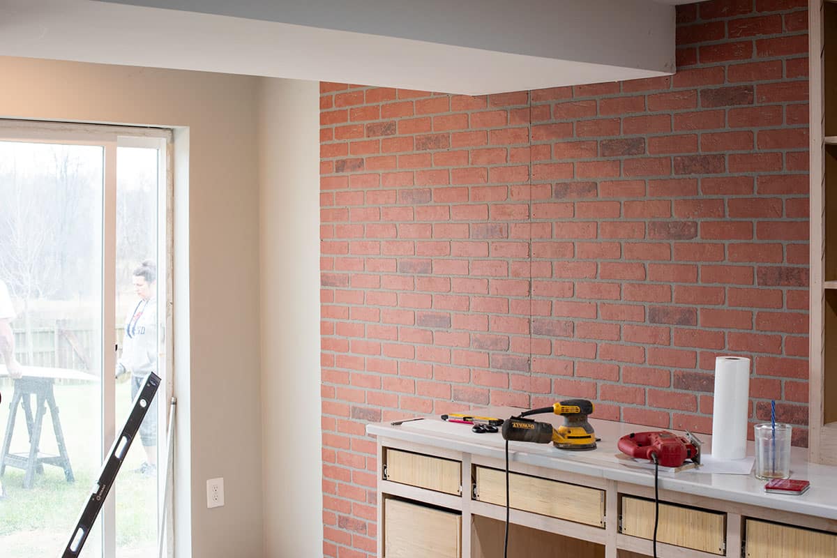 Faux brick panels installed on a wall.