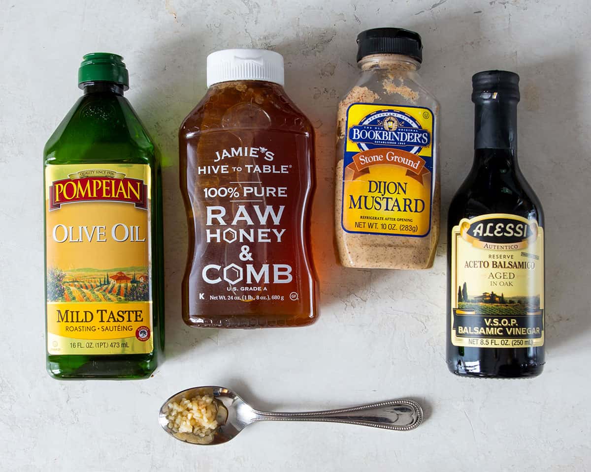 Balsamic vinaigrette recipe ingredients including honey, olive oil, Dijon and balsamic. vinegar.