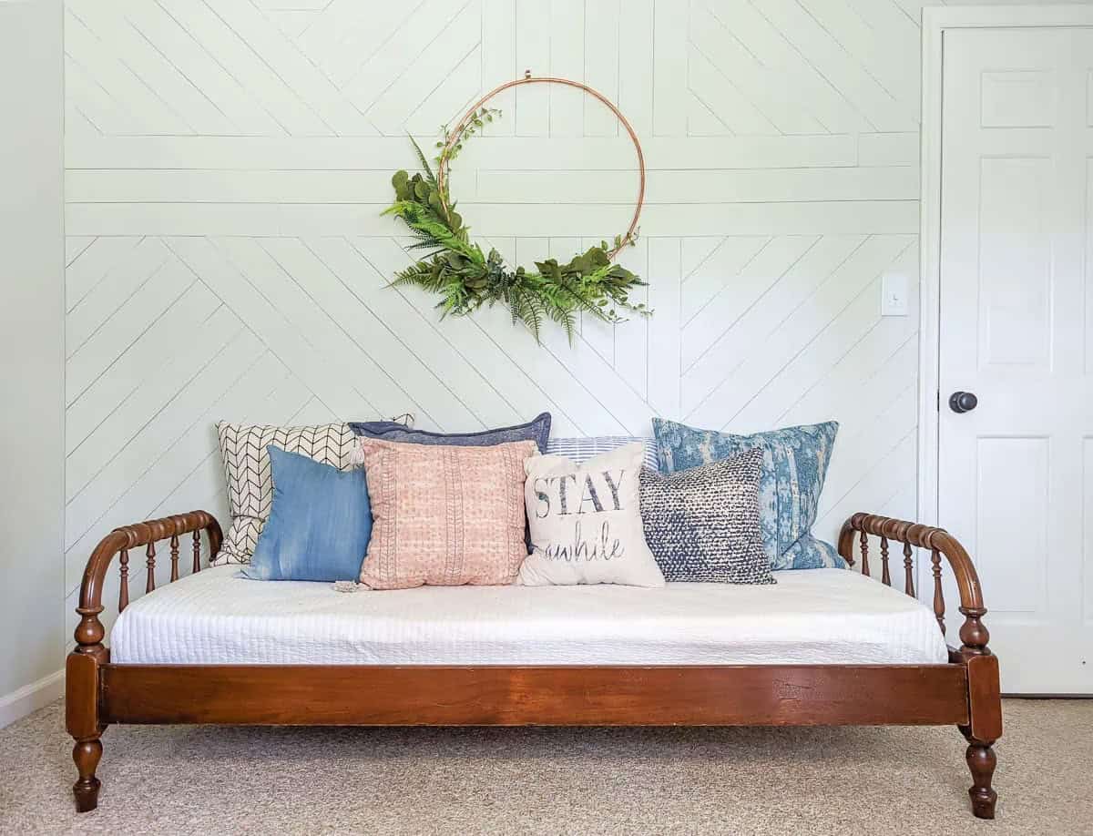 This DIY accent shiplap wall in modern geometric shapes using inexpensive sheets of plywood.