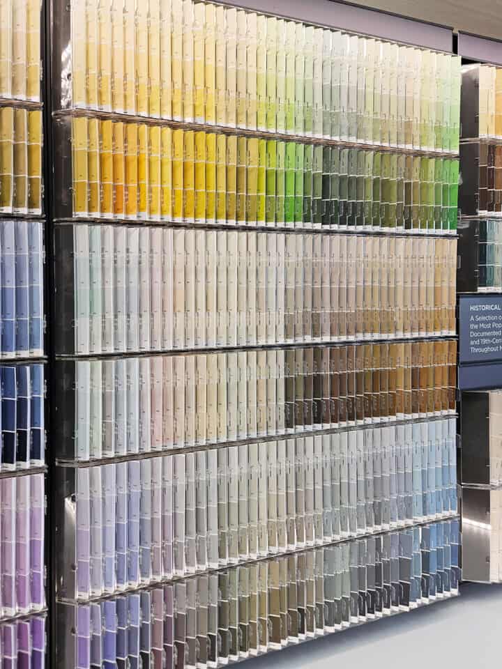 A color collection of paint swatches in a paint store including gray paints.